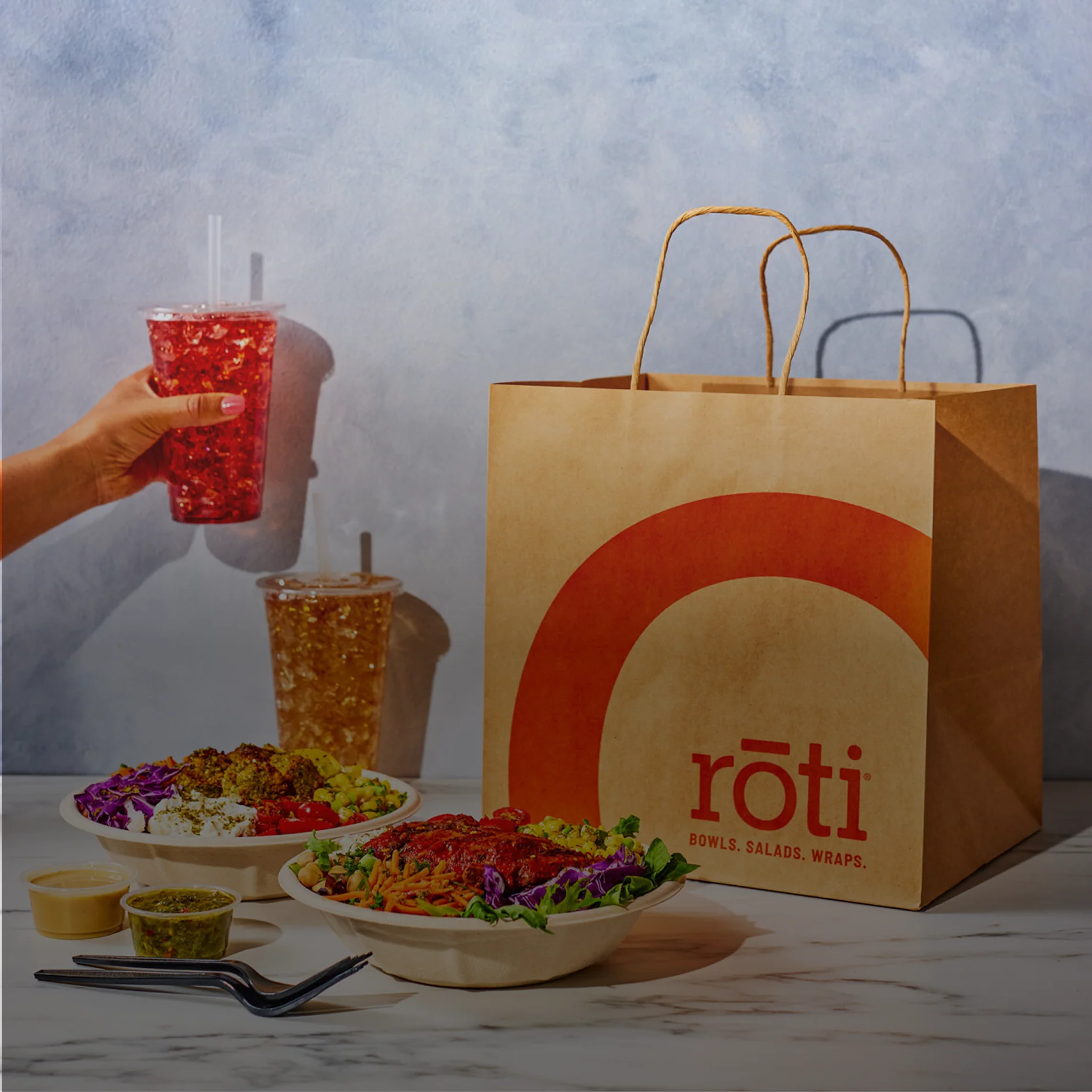 Roti bowls, drinks and takeaway bag